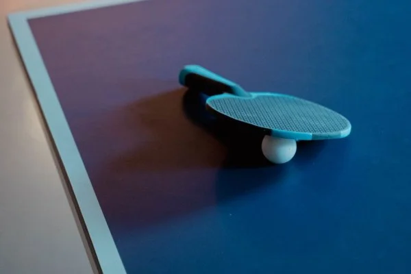 ping pong paddle and ball